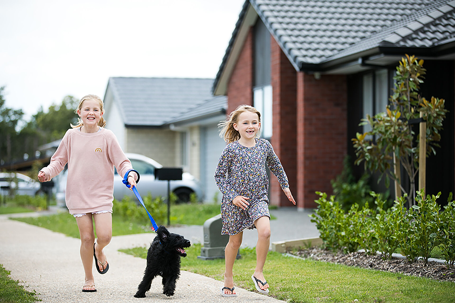 Classic Builders Girls Running Outside with Dog  Web LR