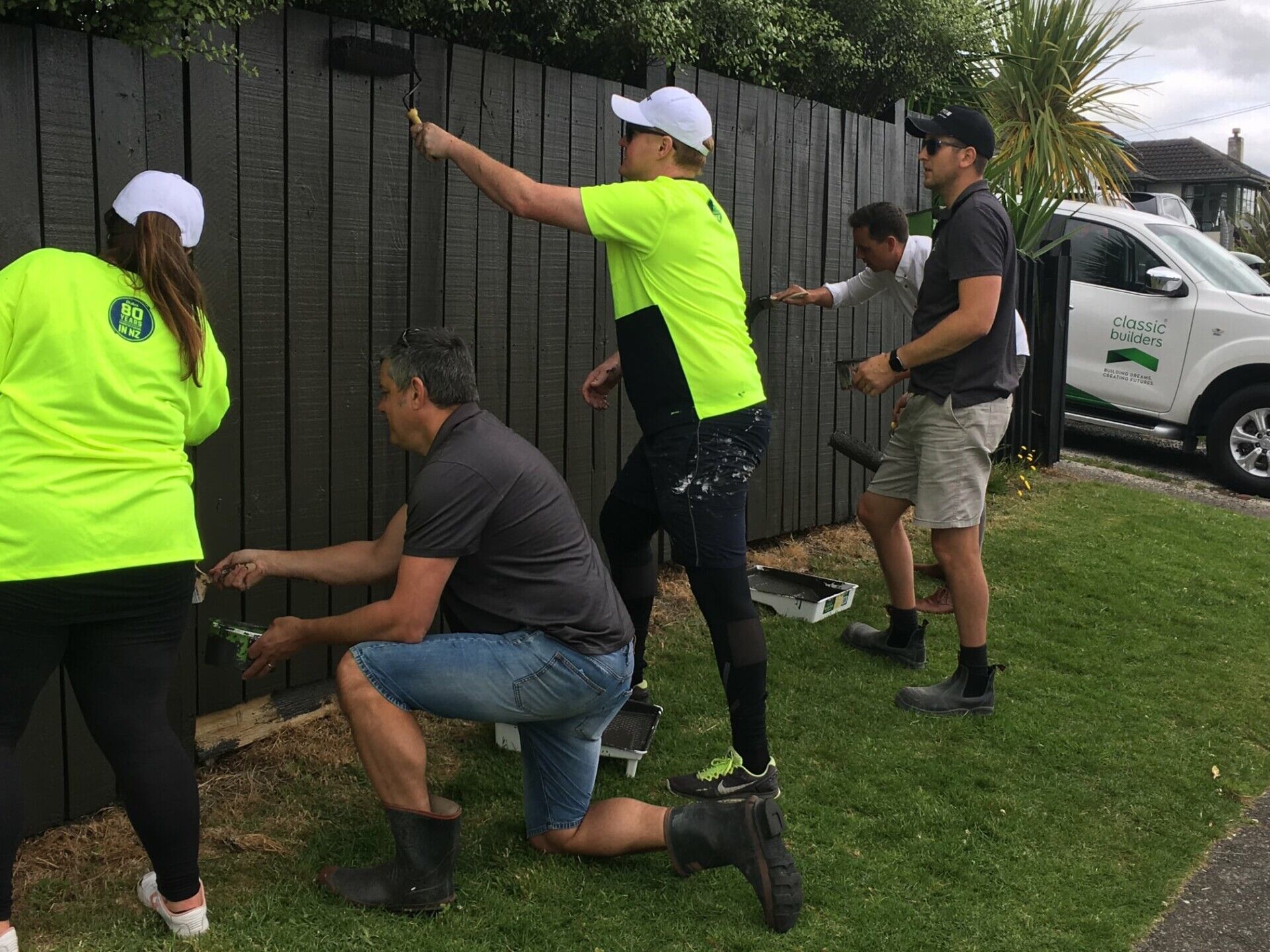 BOP Team painting fence for Good Neighbour